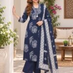 Woman wearing navy blue Cotton Jaipuri Print Kurti Set with white floral patterns and dupatta outdoors